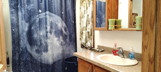 full bath with vanity and a shower with shower curtain