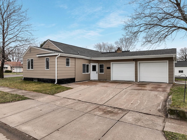 single story home featuring an attached garage, a shingled roof, a chimney, and concrete driveway