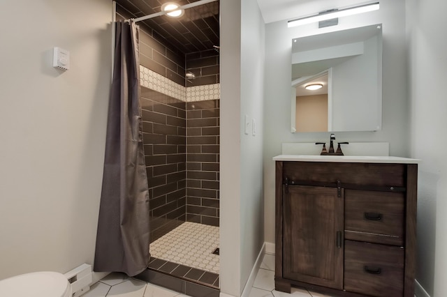 bathroom with toilet, vanity, tile patterned flooring, and a tile shower