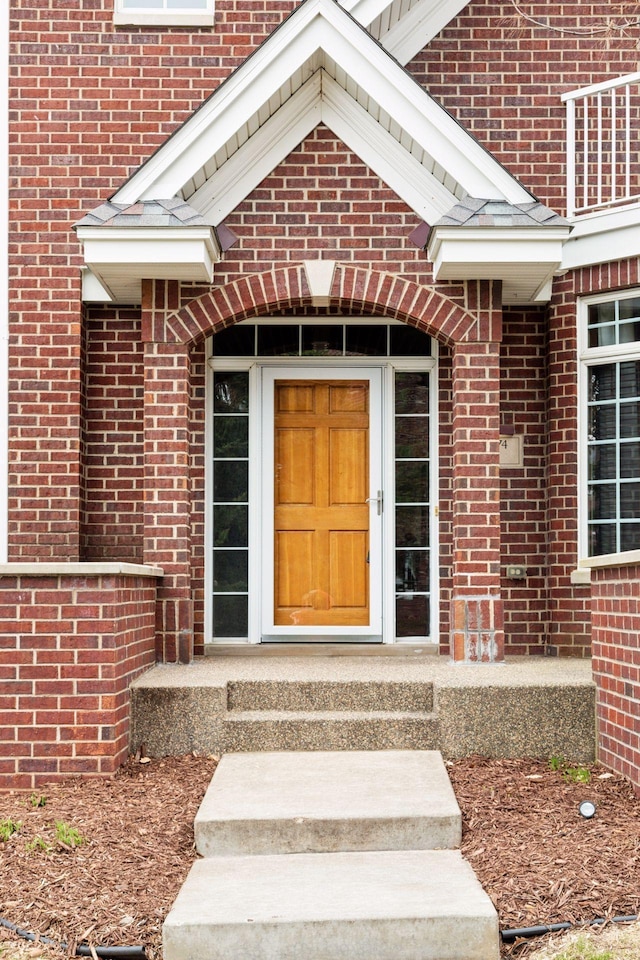 property entrance with brick siding