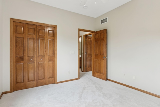 bedroom with light colored carpet, baseboards, visible vents, and ceiling fan