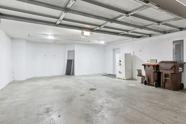 garage featuring a garage door opener and electric panel