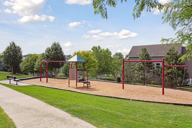 community jungle gym featuring a lawn