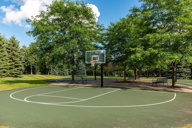 view of basketball court with community basketball court and a yard