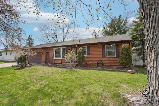 view of front of home featuring driveway, a front yard, and faux log siding