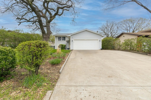 view of front of house featuring a garage and concrete driveway