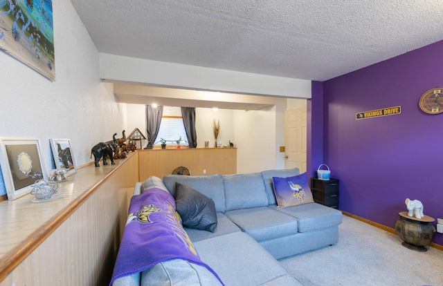 carpeted living room with a textured ceiling