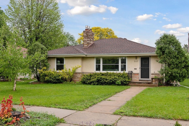 6107 Oliver Ave S, Minneapolis, MN 55419 - view of front facade featuring stucco siding, a front lawn, and a shingled roof