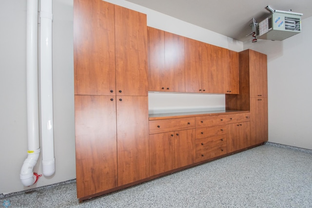 interior space featuring a heating unit and light speckled floor