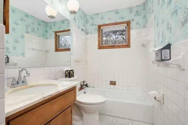 bathroom featuring vanity, toilet, tile patterned floors, wallpapered walls, and tile walls
