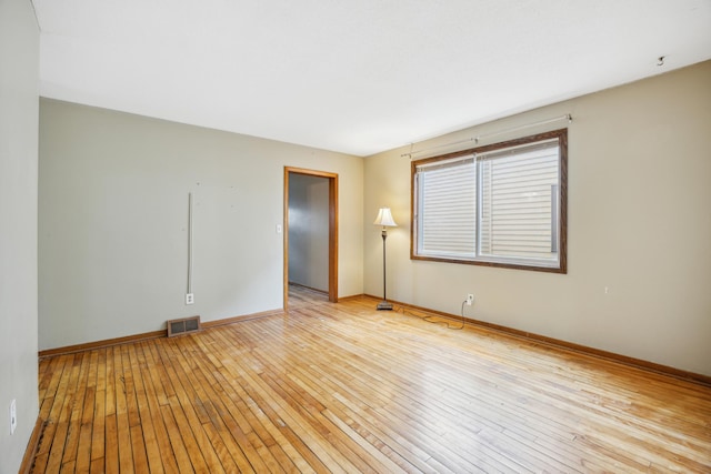 1622 Washington St NE, Minneapolis, MN 55413 - empty room featuring light wood-type flooring, baseboards, and visible vents