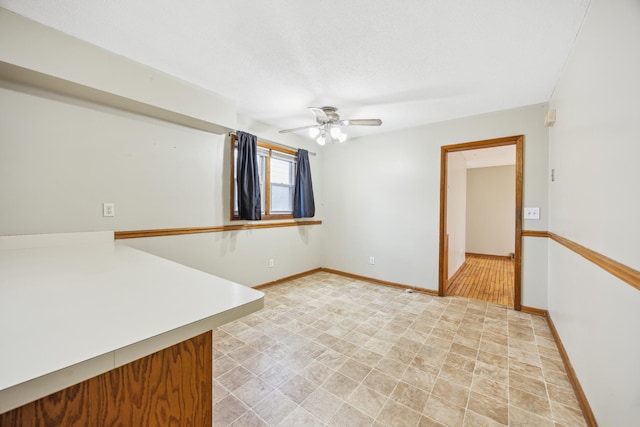 1622 Washington St NE, Minneapolis, MN 55413 - spare room featuring baseboards and ceiling fan