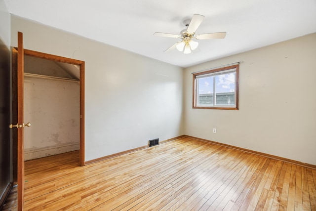 1622 Washington St NE, Minneapolis, MN 55413 - unfurnished bedroom with hardwood / wood-style floors, baseboards, visible vents, and ceiling fan