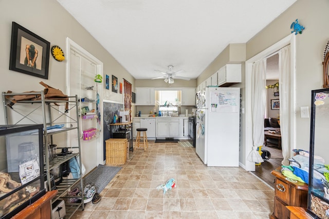 1622 Washington St NE, Minneapolis, MN 55413 - kitchen with white cabinets, light countertops, white appliances, and ceiling fan