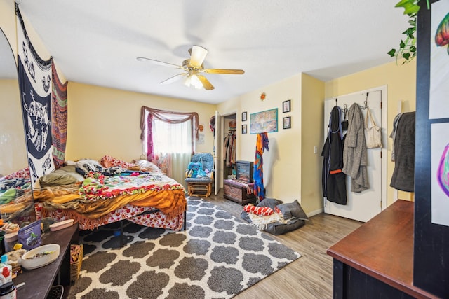 1622 Washington St NE, Minneapolis, MN 55413 - bedroom with baseboards, a ceiling fan, and wood finished floors