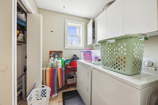 1622 Washington St NE, Minneapolis, MN 55413 - clothes washing area with cabinet space, light tile patterned floors, and separate washer and dryer