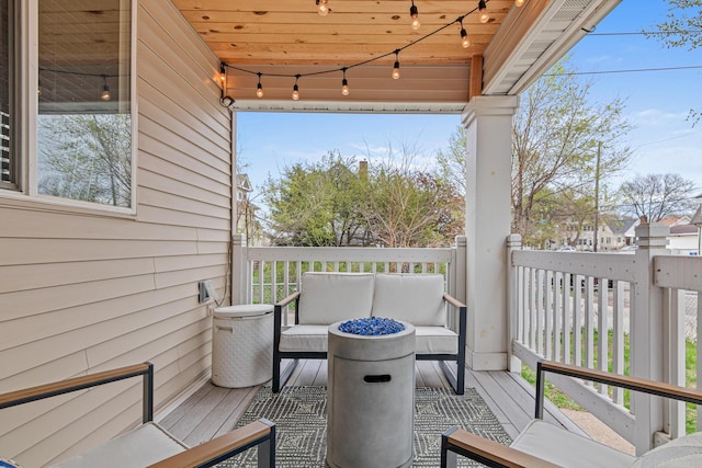 wooden deck with outdoor lounge area