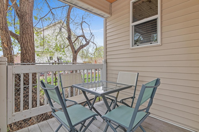 wooden deck with outdoor dining space
