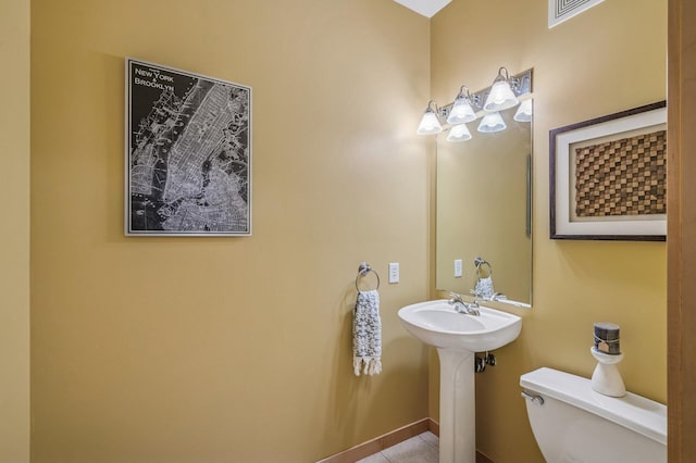 820 Emerald St Unit 110, Saint Paul, MN 55114 - bathroom featuring toilet and tile patterned flooring