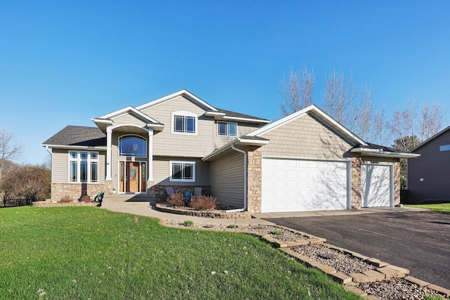 710 Rush Creek Ln, Rush City, MN 55069 - view of front facade with an attached garage, a front lawn, aphalt driveway, and stone siding