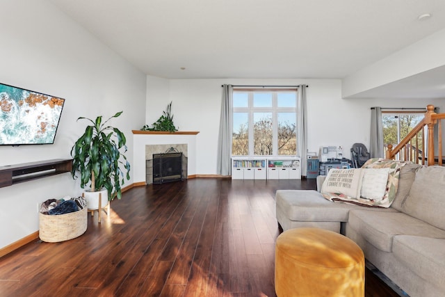 710 Rush Creek Ln, Rush City, MN 55069 - living room with a tiled fireplace, baseboards, and wood finished floors