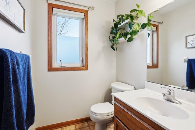 710 Rush Creek Ln, Rush City, MN 55069 - half bath featuring baseboards, vanity, and toilet