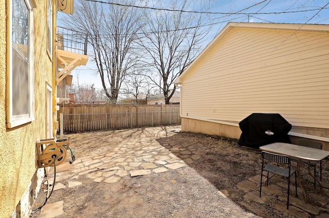 view of patio with fence and grilling area