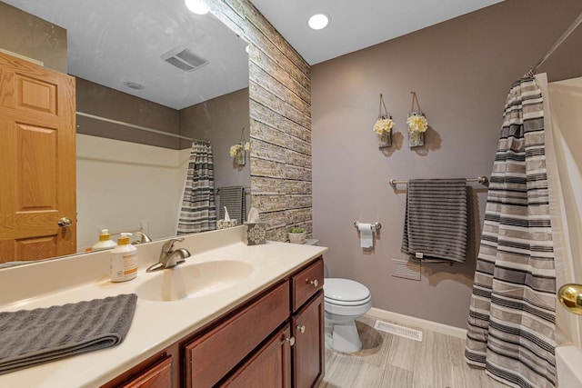 29107 Danel Ave, Randolph, MN 55065 - full bathroom with toilet, vanity, baseboards, and a shower with curtain
