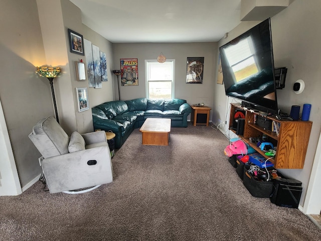 living room with carpet and baseboards