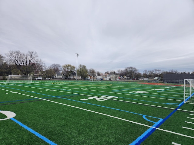 view of home's community with an area for sports
