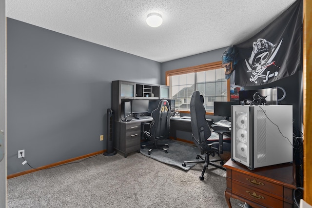 carpeted office space featuring a textured ceiling and baseboards