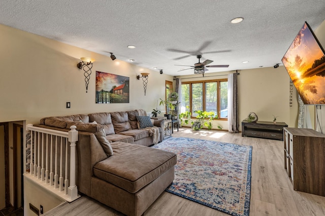 1302 Birch Dr, Hudson, WI 54016 - living room featuring a textured ceiling, a ceiling fan, light wood finished floors, and recessed lighting