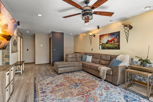 1302 Birch Dr, Hudson, WI 54016 - living area with a ceiling fan, light wood-type flooring, baseboards, a textured ceiling, and recessed lighting