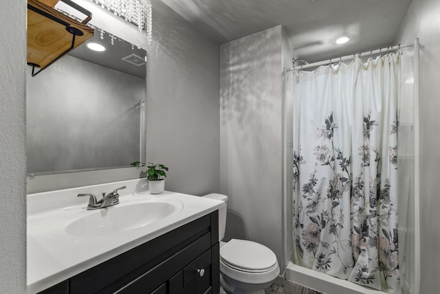 1302 Birch Dr, Hudson, WI 54016 - bathroom with toilet, a stall shower, vanity, and recessed lighting