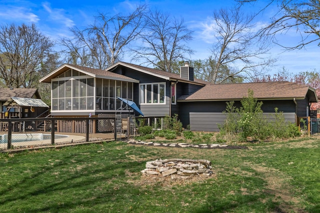 1302 Birch Dr, Hudson, WI 54016 - back of property featuring a sunroom, a chimney, and a shingled roof