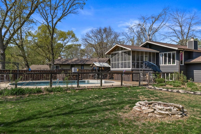 1302 Birch Dr, Hudson, WI 54016 - back of house featuring a sunroom and a chimney