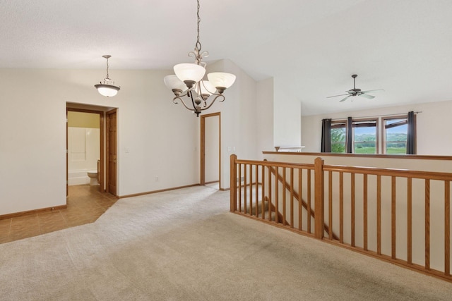 2117 14th St NE, Faribault, MN 55021 - spare room with vaulted ceiling, carpet, a chandelier, and a ceiling fan
