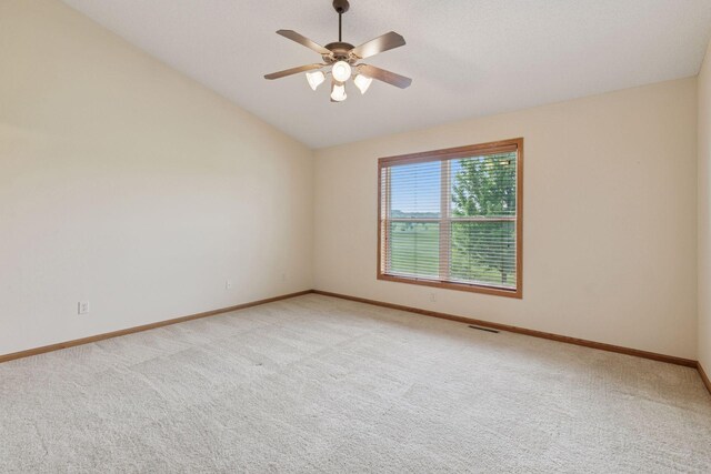 2117 14th St NE, Faribault, MN 55021 - unfurnished room featuring light carpet, ceiling fan, and vaulted ceiling