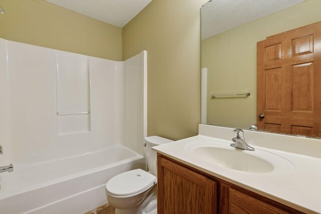 2117 14th St NE, Faribault, MN 55021 - bathroom with a textured ceiling, vanity, and bathtub / shower combination