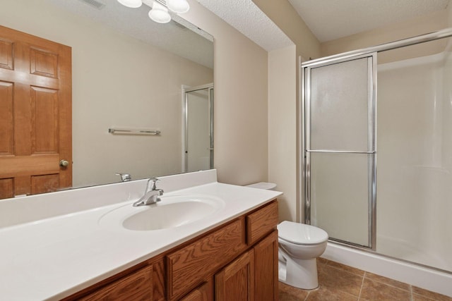 2117 14th St NE, Faribault, MN 55021 - full bathroom with a stall shower, vanity, and tile patterned floors