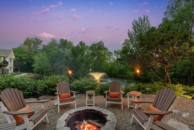 5761 Sunnybrook Ln, Minnetrista, MN 55364 - view of patio featuring a fire pit and a water view