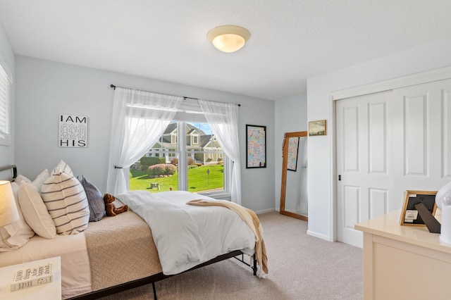 5761 Sunnybrook Ln, Minnetrista, MN 55364 - bedroom featuring light carpet, a closet, and baseboards