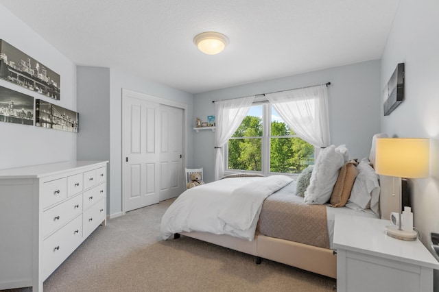 5761 Sunnybrook Ln, Minnetrista, MN 55364 - bedroom featuring light carpet and a closet
