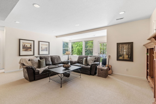 5761 Sunnybrook Ln, Minnetrista, MN 55364 - living room featuring light carpet, baseboards, recessed lighting, and a textured ceiling