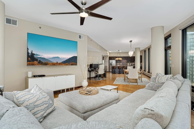 1240 2nd St Unit 701, Minneapolis, MN 55415 - living area with light wood-style flooring and a ceiling fan