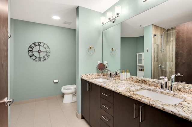 1240 2nd St Unit 701, Minneapolis, MN 55415 - full bath with toilet, tiled shower, double vanity, and baseboards