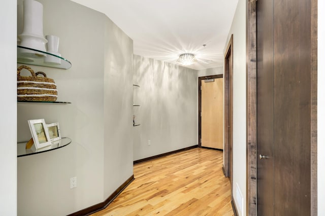 1240 2nd St Unit 701, Minneapolis, MN 55415 - hallway with light wood-style floors and baseboards