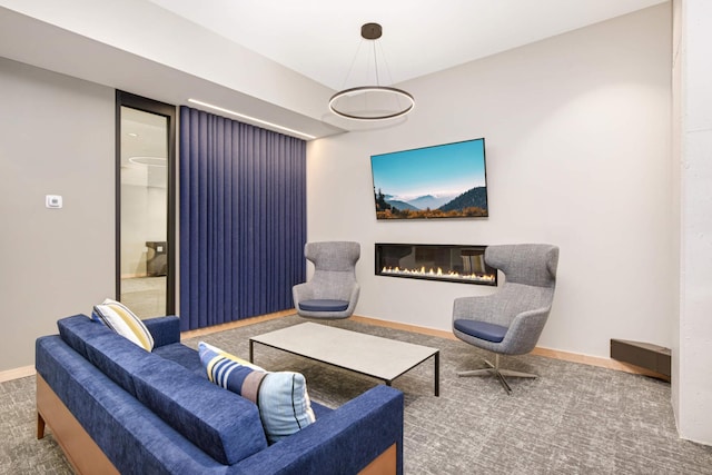 1240 2nd St Unit 701, Minneapolis, MN 55415 - carpeted living room with a glass covered fireplace and baseboards