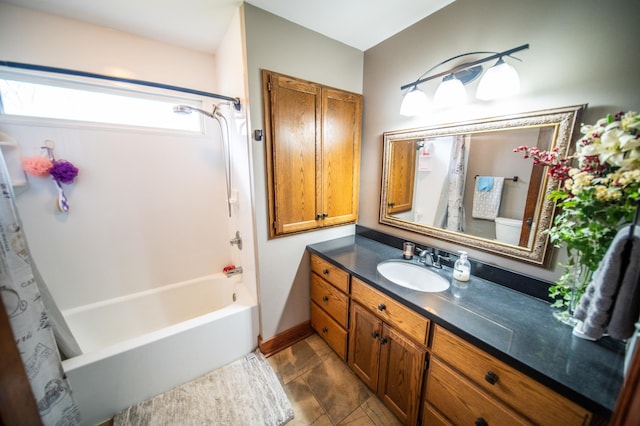 bathroom featuring tile patterned flooring, shower / tub combo, and vanity