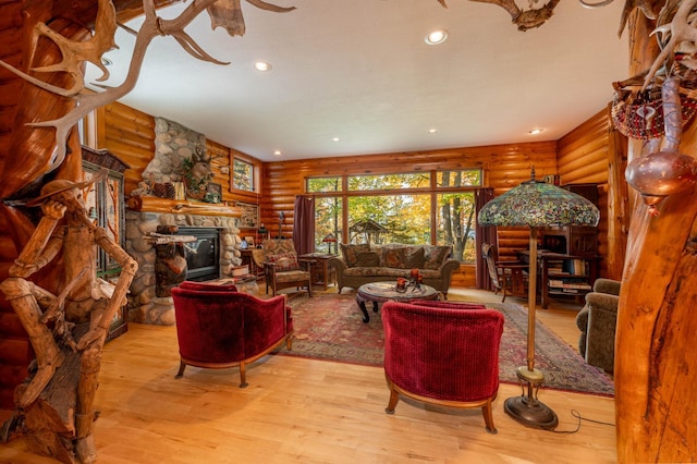 51641 Edgewater Rd, Spring Lake, MN 56680 - living area featuring rustic walls, wood finished floors, a fireplace, and recessed lighting
